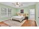 Spacious bedroom with light green walls and hardwood floors at 1073 Vinsetta Cir, Winter Garden, FL 34787