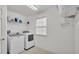 Laundry room with washer, dryer, and overhead storage at 1073 Vinsetta Cir, Winter Garden, FL 34787