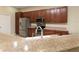 Modern kitchen with stainless steel appliances and wood cabinets at 4568 Back Nine Dr, Winter Haven, FL 33884