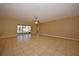 Spacious living area with tile floors and sliding glass doors leading to patio at 4568 Back Nine Dr, Winter Haven, FL 33884