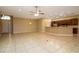 Open floor plan living area with tile floors and kitchen island at 4568 Back Nine Dr, Winter Haven, FL 33884
