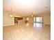 Open concept living room and kitchen with tile floors and a ceiling fan at 4568 Back Nine Dr, Winter Haven, FL 33884
