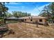 Backyard view of home with pool and garden at 8881 Cypresswood Dr, Lake Wales, FL 33898
