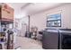 Bright laundry room with washer, dryer, and utility sink at 8881 Cypresswood Dr, Lake Wales, FL 33898