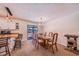 Dining room adjacent to kitchen, featuring a wooden table and chairs at 8881 Cypresswood Dr, Lake Wales, FL 33898