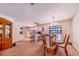 Kitchen and dining area with light cabinets and hardwood floors at 8881 Cypresswood Dr, Lake Wales, FL 33898