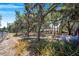 Backyard with mature trees and grassy area at 8881 Cypresswood Dr, Lake Wales, FL 33898