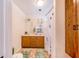 Clean bathroom with a double vanity and shower at 8881 Cypresswood Dr, Lake Wales, FL 33898