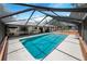 Inviting, screened-in pool with ample deck space at 8881 Cypresswood Dr, Lake Wales, FL 33898
