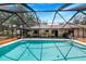 Enjoy this refreshing pool with a screened enclosure at 8881 Cypresswood Dr, Lake Wales, FL 33898