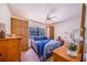 Cozy bedroom with a full-size bed and large windows at 8881 Cypresswood Dr, Lake Wales, FL 33898