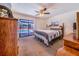 Main bedroom with pool view and sliding glass doors at 8881 Cypresswood Dr, Lake Wales, FL 33898