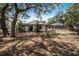 Single-story home with a pool and screened enclosure at 8881 Cypresswood Dr, Lake Wales, FL 33898