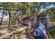 Two storage sheds in the backyard, one is red at 8881 Cypresswood Dr, Lake Wales, FL 33898