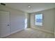 Well-lit bedroom with a large window and carpeted floors at 1472 Leamington Ln, Winter Haven, FL 33884