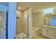 Bathroom with shower, tub, and vanity at 1472 Leamington Ln, Winter Haven, FL 33884