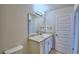 Modern bathroom with granite countertop and updated fixtures at 1472 Leamington Ln, Winter Haven, FL 33884