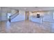 Open kitchen with island, stainless steel appliances, and white cabinets at 1472 Leamington Ln, Winter Haven, FL 33884