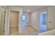 Upper level hallway with doors to bedrooms and a closet at 1472 Leamington Ln, Winter Haven, FL 33884