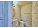 Clean and modern half bathroom with pedestal sink and toilet at 1472 Leamington Ln, Winter Haven, FL 33884