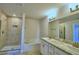 Bathroom with shower, tub, and double vanity at 1472 Leamington Ln, Winter Haven, FL 33884