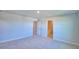 Bright bedroom with carpet and access to bathroom at 1472 Leamington Ln, Winter Haven, FL 33884