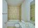 Bathroom with tiled walls, bathtub, and granite countertop at 1472 Leamington Ln, Winter Haven, FL 33884