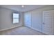 Bedroom with double door closet and window at 1472 Leamington Ln, Winter Haven, FL 33884