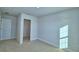 Spacious bedroom with carpeted floor, a window, and a closet at 1472 Leamington Ln, Winter Haven, FL 33884
