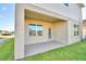 Private covered patio with access from the house at 1472 Leamington Ln, Winter Haven, FL 33884