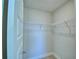 Walk-in closet with wire shelving and ample storage space at 1472 Leamington Ln, Winter Haven, FL 33884