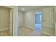 Clean hallway with carpet flooring and access to bedrooms and bathroom at 1472 Leamington Ln, Winter Haven, FL 33884
