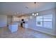 Kitchen features an island and breakfast nook with adjacent dining area at 1472 Leamington Ln, Winter Haven, FL 33884