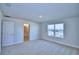 Spacious bedroom with large window and bathroom access at 1472 Leamington Ln, Winter Haven, FL 33884