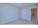 Spacious bedroom with carpeted floor and neutral wall colors at 1472 Leamington Ln, Winter Haven, FL 33884