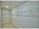 Spacious walk-in closet with wire shelving at 1472 Leamington Ln, Winter Haven, FL 33884