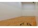 Well-lit racquetball court with hardwood floor at 4568 Back Nine Dr, Winter Haven, FL 33884