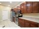 Modern kitchen with stainless steel appliances and ample wood cabinetry at 4568 Back Nine Dr, Winter Haven, FL 33884
