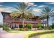 Two-story home with large balcony and palm trees at 4568 Back Nine Dr, Winter Haven, FL 33884