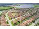 Aerial view of a beautiful community with lake and numerous houses at 4568 Back Nine Dr, Winter Haven, FL 33884