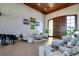 Spacious community room with comfortable seating and a piano at 4568 Back Nine Dr, Winter Haven, FL 33884