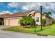 House with a two-car garage and a manicured lawn at 4568 Back Nine Dr, Winter Haven, FL 33884