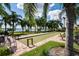 Enjoy bocce ball by the lake with lush landscaping at 4568 Back Nine Dr, Winter Haven, FL 33884