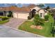 Single-story home with two-car garage and landscaped yard at 4568 Back Nine Dr, Winter Haven, FL 33884