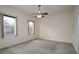 Comfortable bedroom with ceiling fan and two windows at 4568 Back Nine Dr, Winter Haven, FL 33884