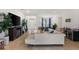 Open living room with a sectional sofa, and views into the dining area at 6421 Alamanda Hills Dr, Lakeland, FL 33813