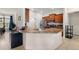 Modern kitchen with granite countertops and stainless steel appliances at 6421 Alamanda Hills Dr, Lakeland, FL 33813