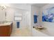 Main bathroom with double vanity, shower, and soaking tub at 6421 Alamanda Hills Dr, Lakeland, FL 33813