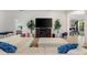 Spacious living room featuring a large sectional sofa and electric fireplace at 6421 Alamanda Hills Dr, Lakeland, FL 33813