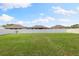 Large backyard with privacy fence and green grass at 6421 Alamanda Hills Dr, Lakeland, FL 33813